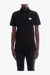 Dolce &amp; Gabbana men’s black cotton short-sleeved polo shirt with silver rectangular logo patch on left chest