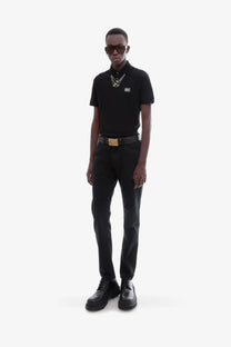 Dolce &amp; Gabbana men’s black cotton polo shirt with short sleeves subtle logo patch and layered silver chain neckline detailing