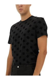 Dolce and Gabbana men’s black cotton t-shirt with short sleeves and repeating embossed dg logo pattern