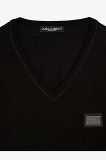 Dolce &amp; Gabbana men’s black cotton v-neck sweater with subtle textured trim and metallic logo patch