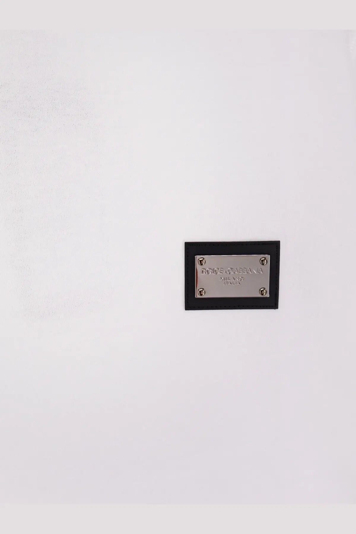 Black leather plaque with silver metal plate featuring dolce and gabbana logo on dolce and gabbana men cotton white shirt
