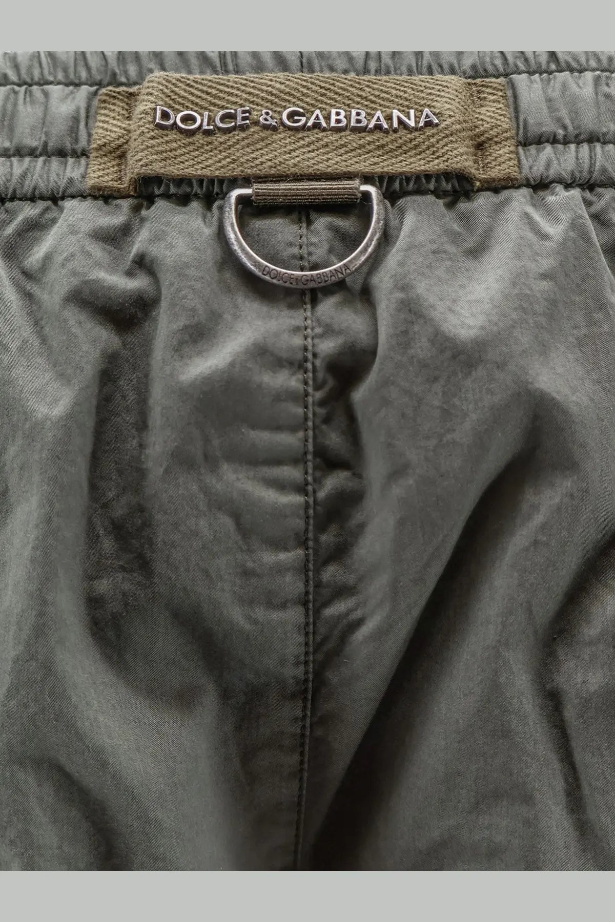 Dolce &amp; gabbana men’s olive green cotton shorts with drawstring, metallic ring, and brand label detail