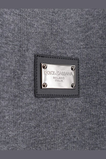 Dolce &amp; Gabbana men’s gray woolen sweater with black leather patch and silver metal plaque logo detail