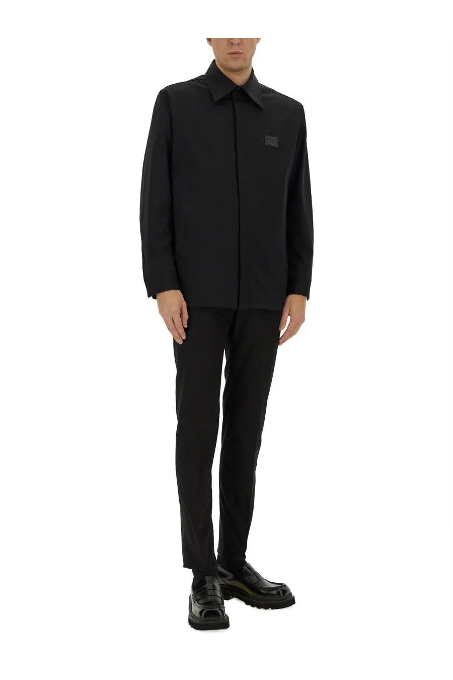 Dolce &amp; gabbana black long-sleeved button-up shirt with subtle square logo patch on left chest paired with tailored cotton pants