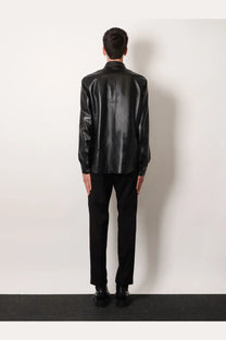 Black glossy faux leather shirt with classic collar and long sleeves paired with dolce &amp; gabbana men’s black cotton trousers