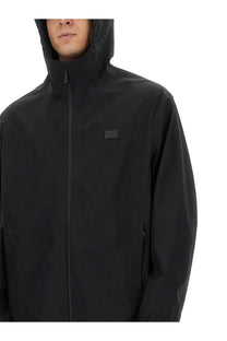 Dolce &amp; Gabbana men’s black hooded jacket with subtle logo patch on chest made from premium material