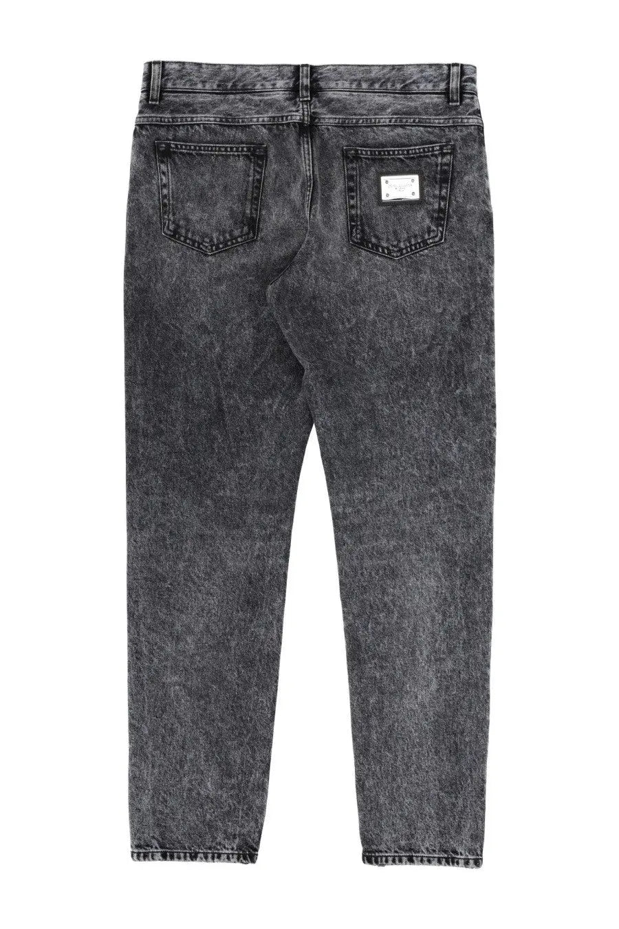 Back view of dolce &amp; gabbana men’s dark gray distressed denim jeans with a silver rectangular brand patch on the pocket