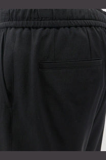 Dolce and Gabbana men’s black jogging stretch virgin wool trousers with drawstring waistband and welt pocket