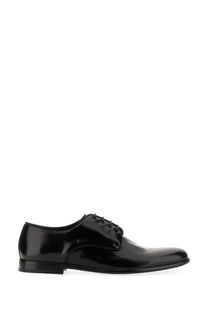 Dolce &amp; Gabbana men’s black leather derby shoe with sleek polished patent leather and classic lace-up design