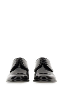 Dolce &amp; Gabbana men’s black patent leather derby shoes with a sleek polished finish and classic lace-up design
