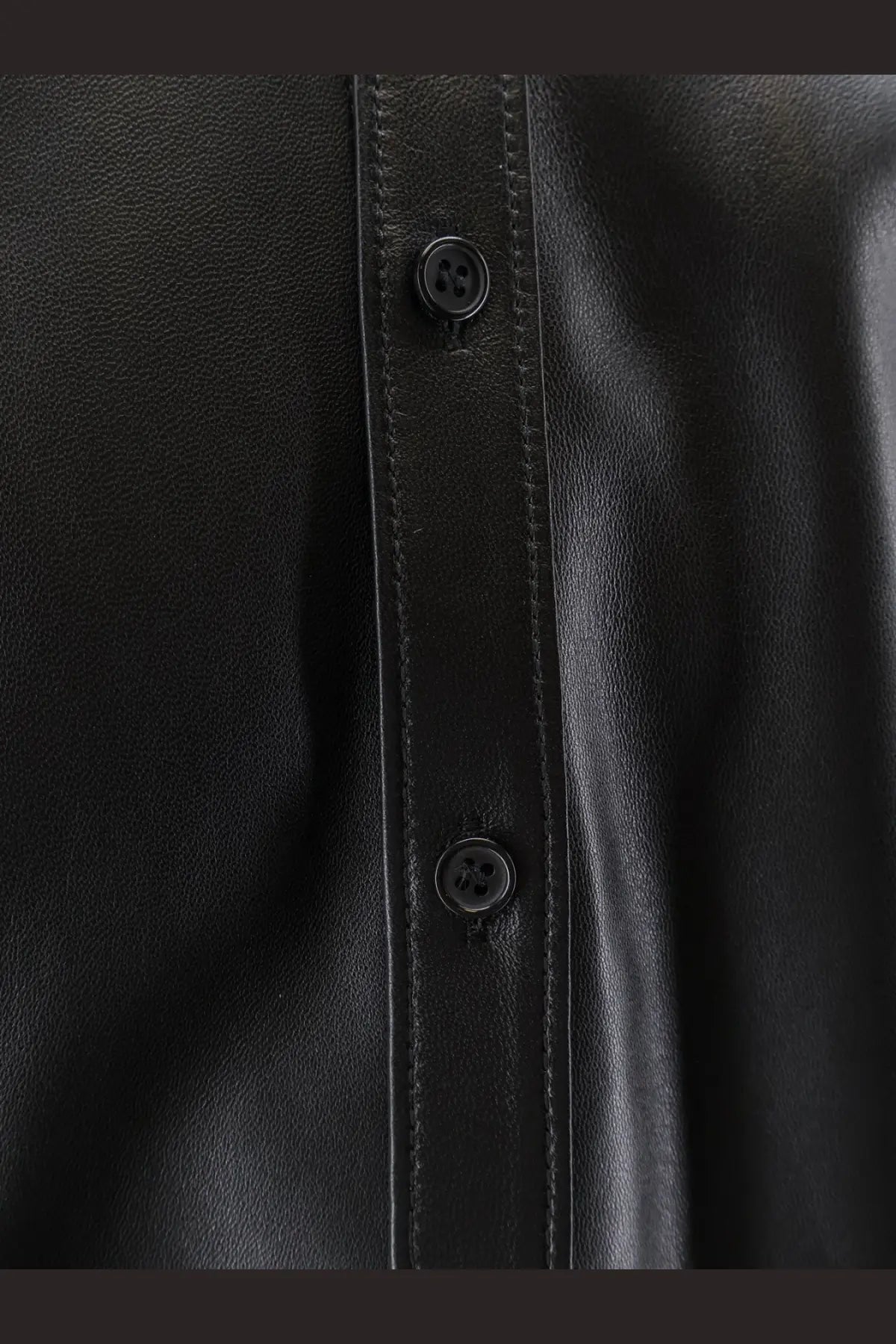 Dolce &amp; Gabbana men’s black leather shirt jacket with subtle stitching along the front placket