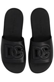 Dolce &amp; Gabbana men’s black leather slide sandals with glossy finish and embossed DG logo on top