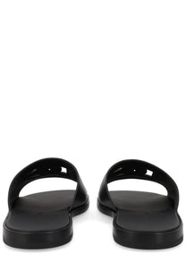 Dolce &amp; Gabbana men’s black leather slide sandals with minimalist design and smooth glossy finish