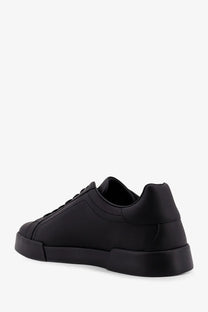 Dolce &amp; Gabbana men’s black leather low-top sneakers with chunky rubber sole and minimalist design
