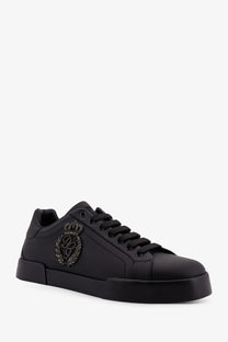 Dolce &amp; Gabbana men’s black leather low-top sneaker with glossy finish and embroidered crown crest on the side