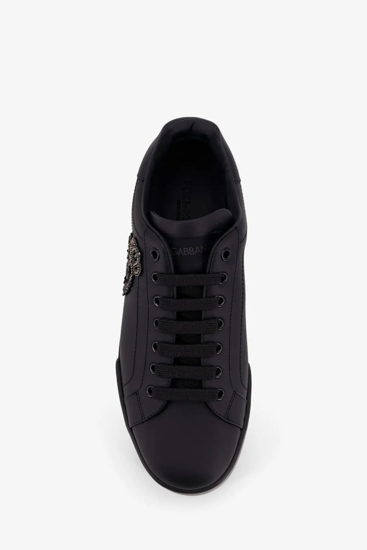 Dolce &amp; Gabbana men’s black leather sneaker with metallic embellishment on the side for stylish casual wear