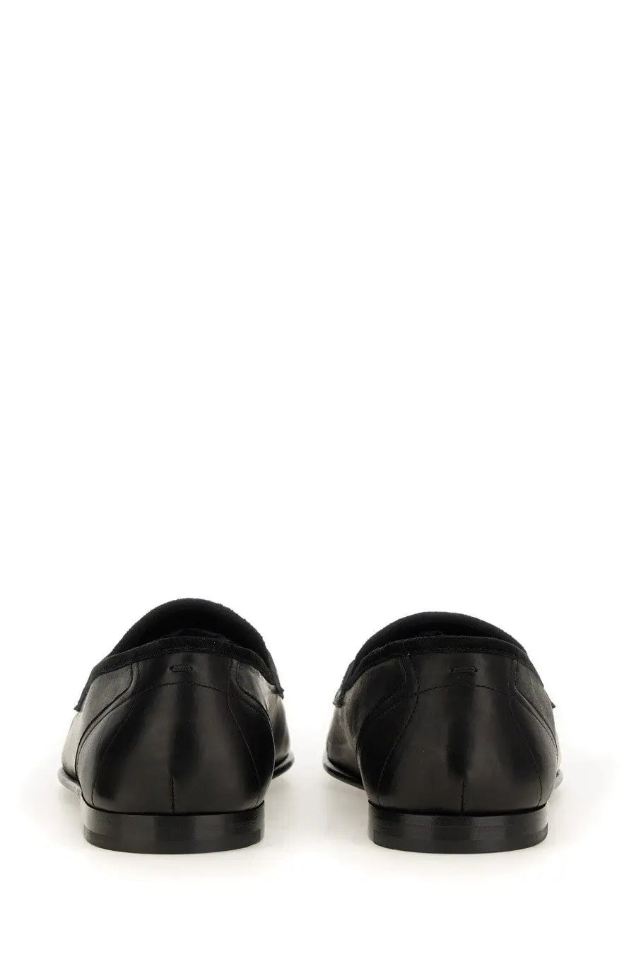 Dolce &amp; Gabbana men’s black leather loafers with a sleek polished finish and classic slip-on design