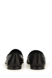 Dolce &amp; Gabbana men’s black leather loafers with a sleek polished finish and classic slip-on design
