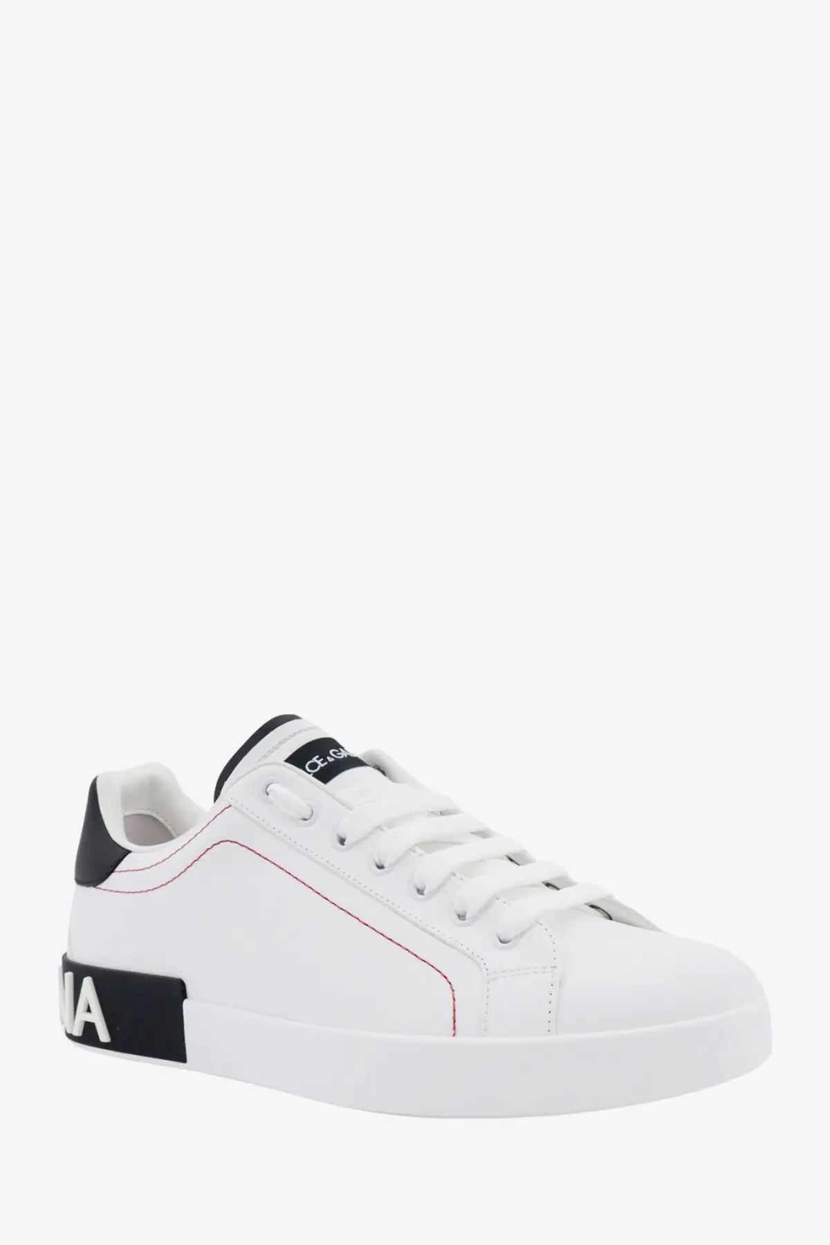 Dolce &amp; Gabbana men’s low top leather sneakers in white with black accents and red stitching
