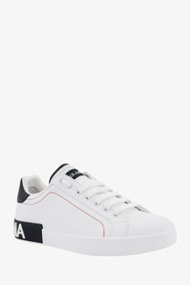 Dolce &amp; Gabbana men’s low top leather sneakers in white with black accents and red stitching