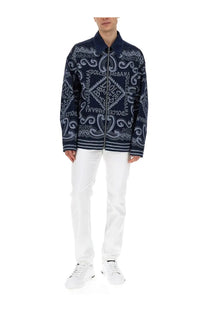 Dolce &amp; Gabbana men’s navy blue cardigan with intricate white paisley and logo patterns in a lightweight knit