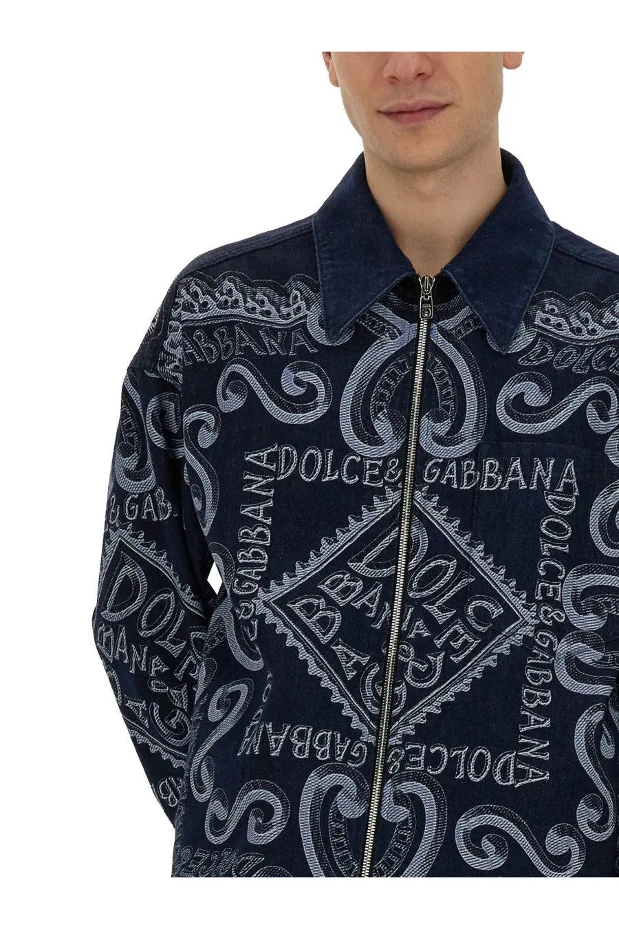 Dark blue denim jacket with all over white embroidered dolce and gabbana logo and ornate swirls for men