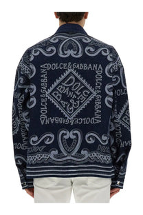 Dolce &amp; Gabbana men’s navy blue denim jacket with intricate white embroidery and branded detailing