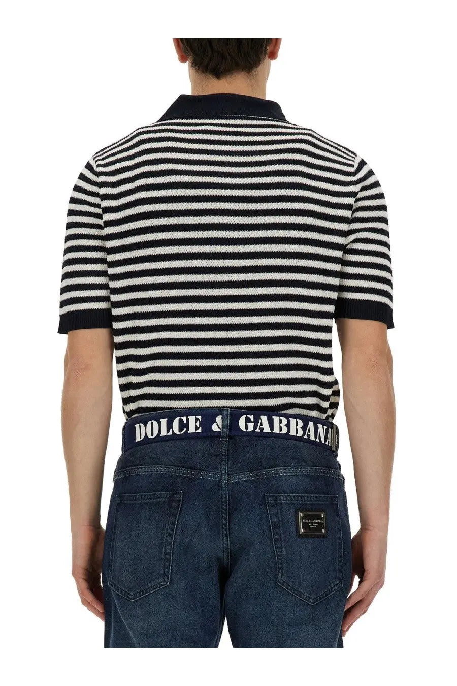 Dolce &amp; Gabbana men’s neck polo shirt in black and white striped knit with navy collar and cuffs paired with denim jeans