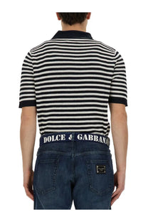 Dolce &amp; Gabbana men’s neck polo shirt in black and white striped knit with navy collar and cuffs paired with denim jeans