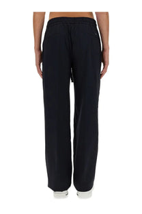 Dolce &amp; Gabbana men’s black nylon wide-leg trousers with elastic waistband and subtle side pockets