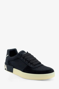 Dolce &amp; Gabbana men’s black low-top sneakers with suede and nylon upper cream rubber sole and white heel branding back view