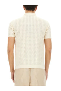 Dolce &amp; Gabbana men’s cream-colored perforated cotton knit polo shirt with subtle vertical cable pattern
