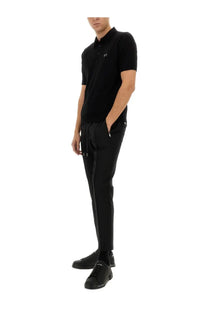 Dolce &amp; Gabbana men’s black short-sleeved polo shirt with a subtle chest logo and soft cotton material