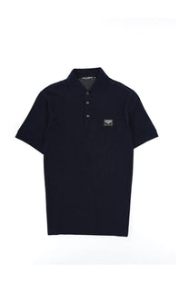 Dolce &amp; Gabbana men’s black polo shirt with subtle textured fabric and small rectangular logo patch on the chest