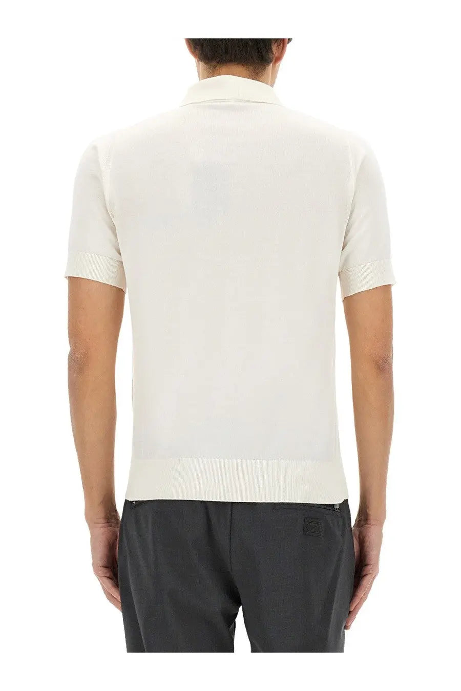 Cream-colored short-sleeved knit polo shirt with ribbed collar and hem from Dolce &amp; Gabbana men’s collection