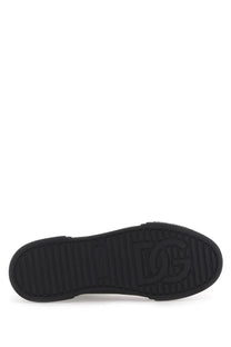 Black rubber sole with embossed dg logo on the Dolce &amp; Gabbana men’s Portfino sneaker black back side