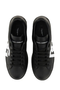 Dolce &amp; Gabbana men’s Portofino black leather sneakers with white logo accents on the sides
