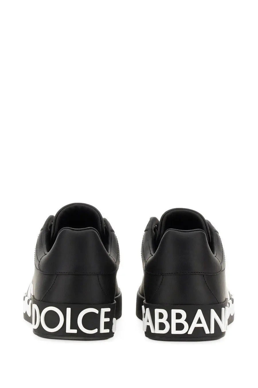 Dolce &amp; Gabbana men’s Portofino black leather sneakers with bold white lettering along the sole