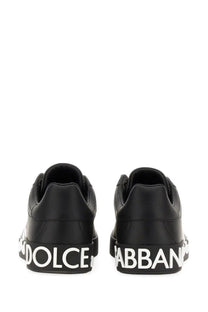 Dolce &amp; Gabbana men’s Portofino black leather sneakers with bold white lettering along the sole
