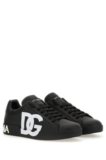 Dolce &amp; Gabbana men’s Portofino sneaker in black leather with bold white DG logo and matching laces on the side