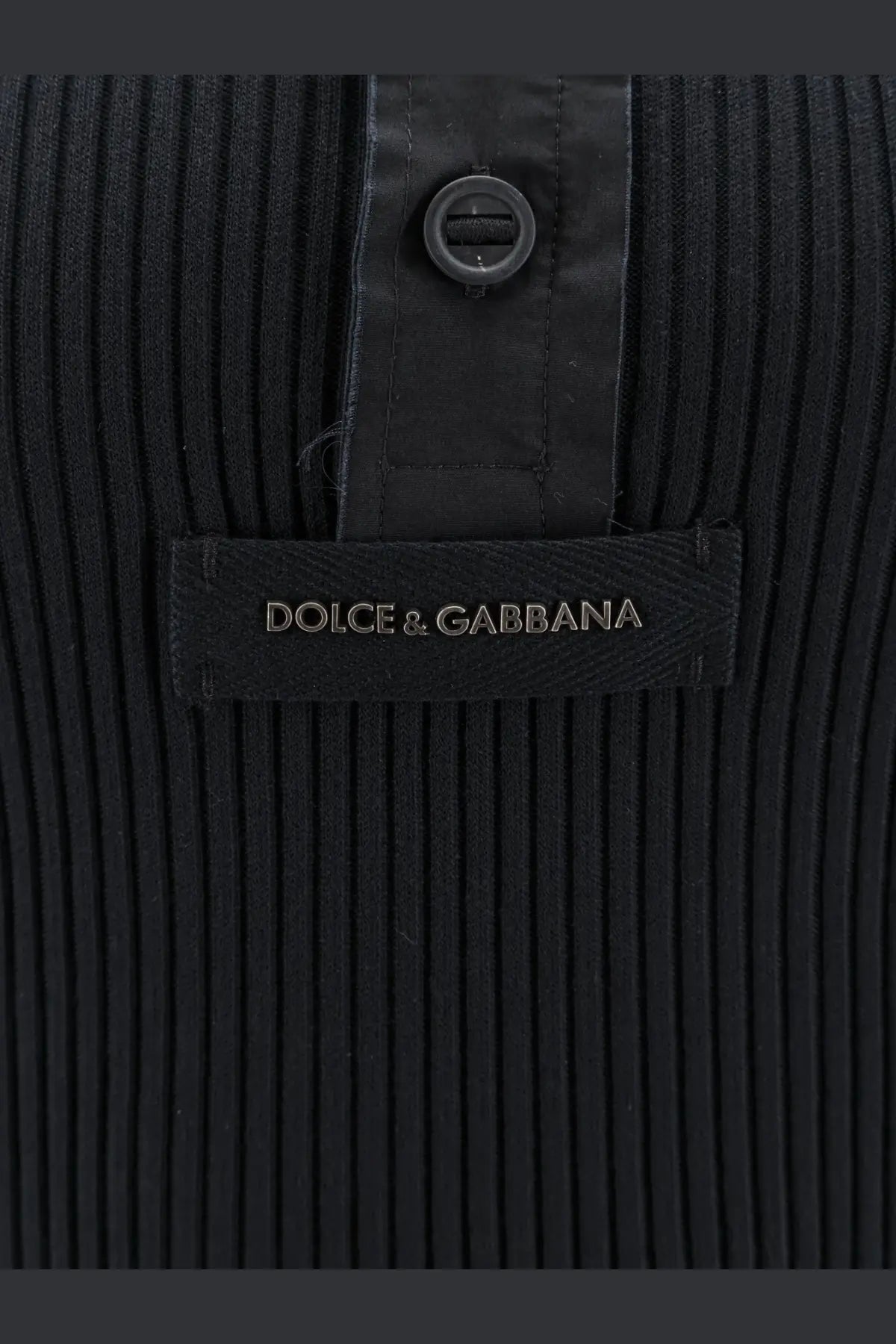 Dolce &amp; Gabbana men’s black ribbed cotton sweater with sleek button closure and branded label