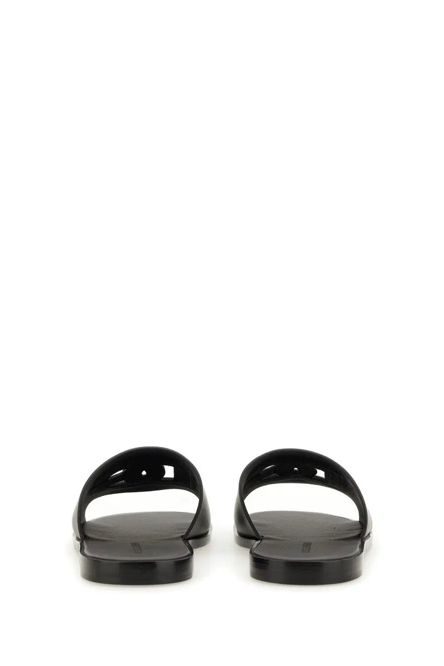 Black glossy rubber slide sandals with minimalist cut-out design for men by Dolce &amp; Gabbana