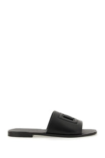 Dolce &amp; Gabbana men’s black leather slide sandal with rectangular logo detail on the strap