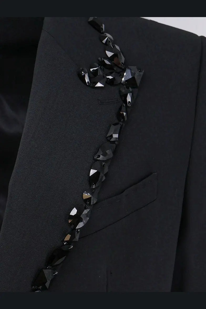A dolce and gabbana men’s sicilia stretch wool blazer in black with a sleek black beaded crystal embellishment on the lapel