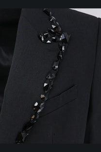A dolce and gabbana men’s sicilia stretch wool blazer in black with a sleek black beaded crystal embellishment on the lapel