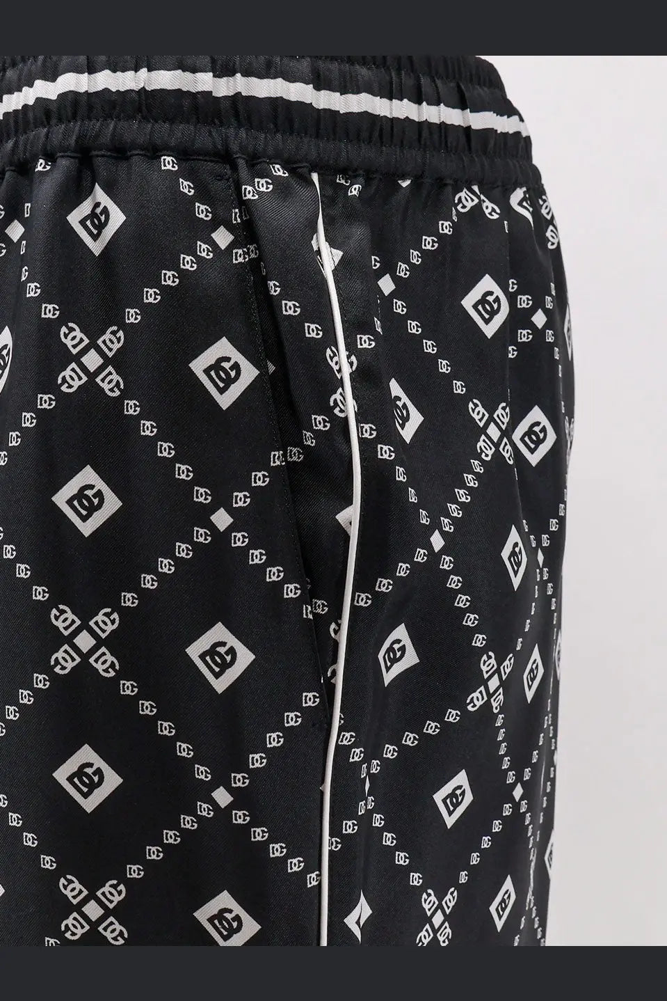 Dolce &amp; Gabbana men’s black silk trousers with dc logo print white stripes and piping detail