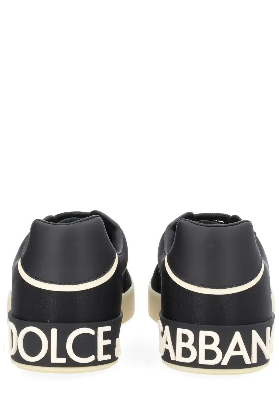 Dolce &amp; Gabbana men’s sneaker black with white lettering and cream-colored sole in a sleek design