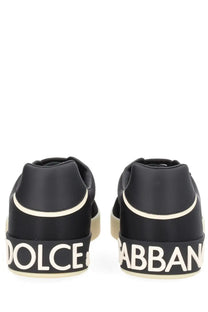 Dolce &amp; Gabbana men’s sneaker black with white lettering and cream-colored sole in a sleek design