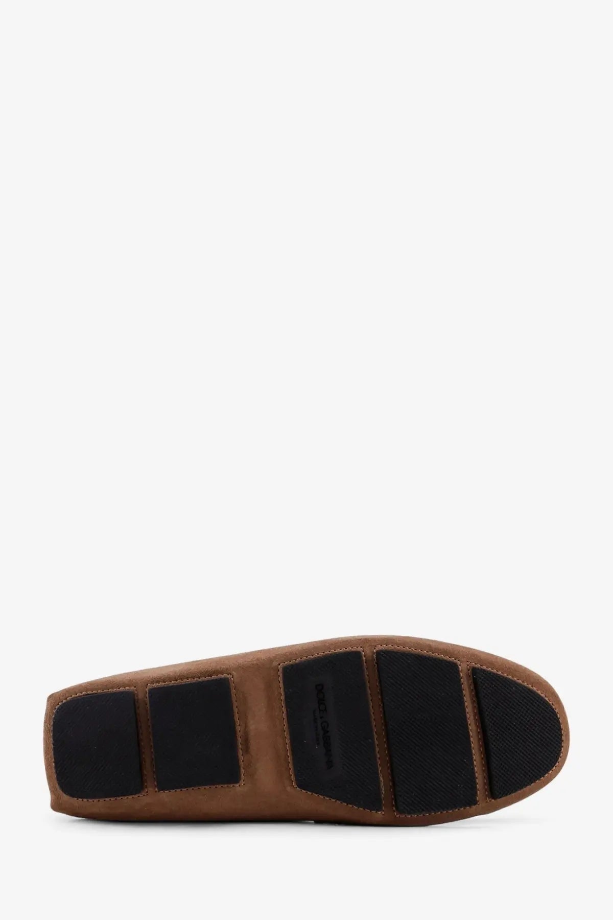Back view of dolce &amp; gabbana men’s beige suede loafer with brown leather driving shoe detail and black rubber soles