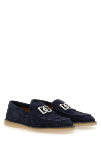 Dolce &amp; Gabbana men’s navy blue suede loafers with silver d and g logo hardware front view